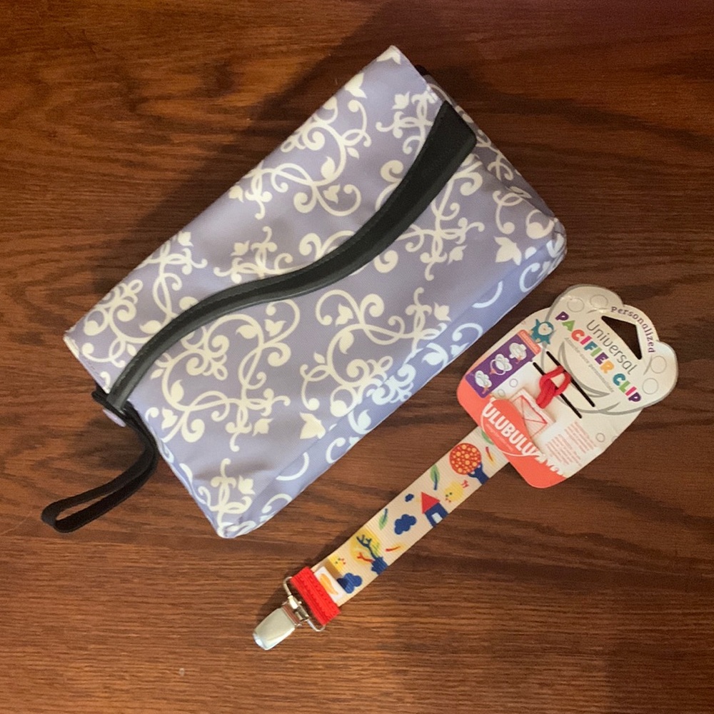 To Go Diaper Changing Pad Kit Purple and a Pacifier Clipper